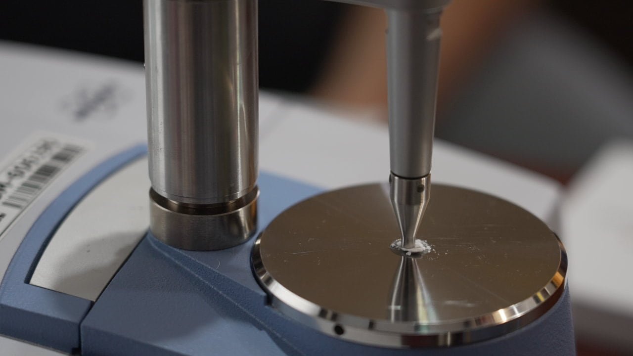 default-416 A machine is used to test the content of a fine white powder.