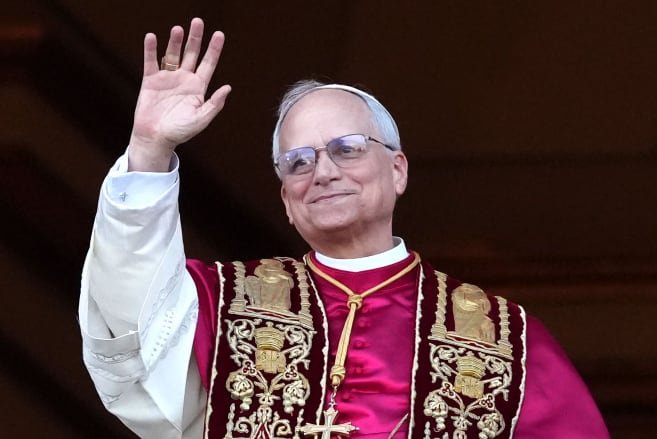 default-200 A man in papal robes waving